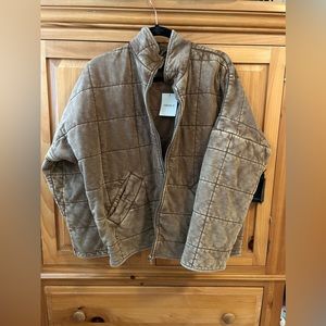 Women's quilted zip up jacket size Large. Never been worn tags still on!